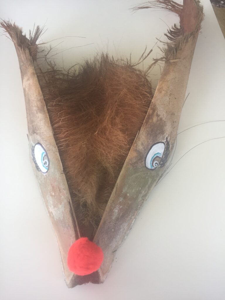 Easy palm frond reindeer with eyes and red nose